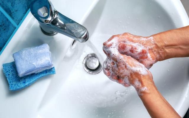 people washing their hands as part of hygiene habits